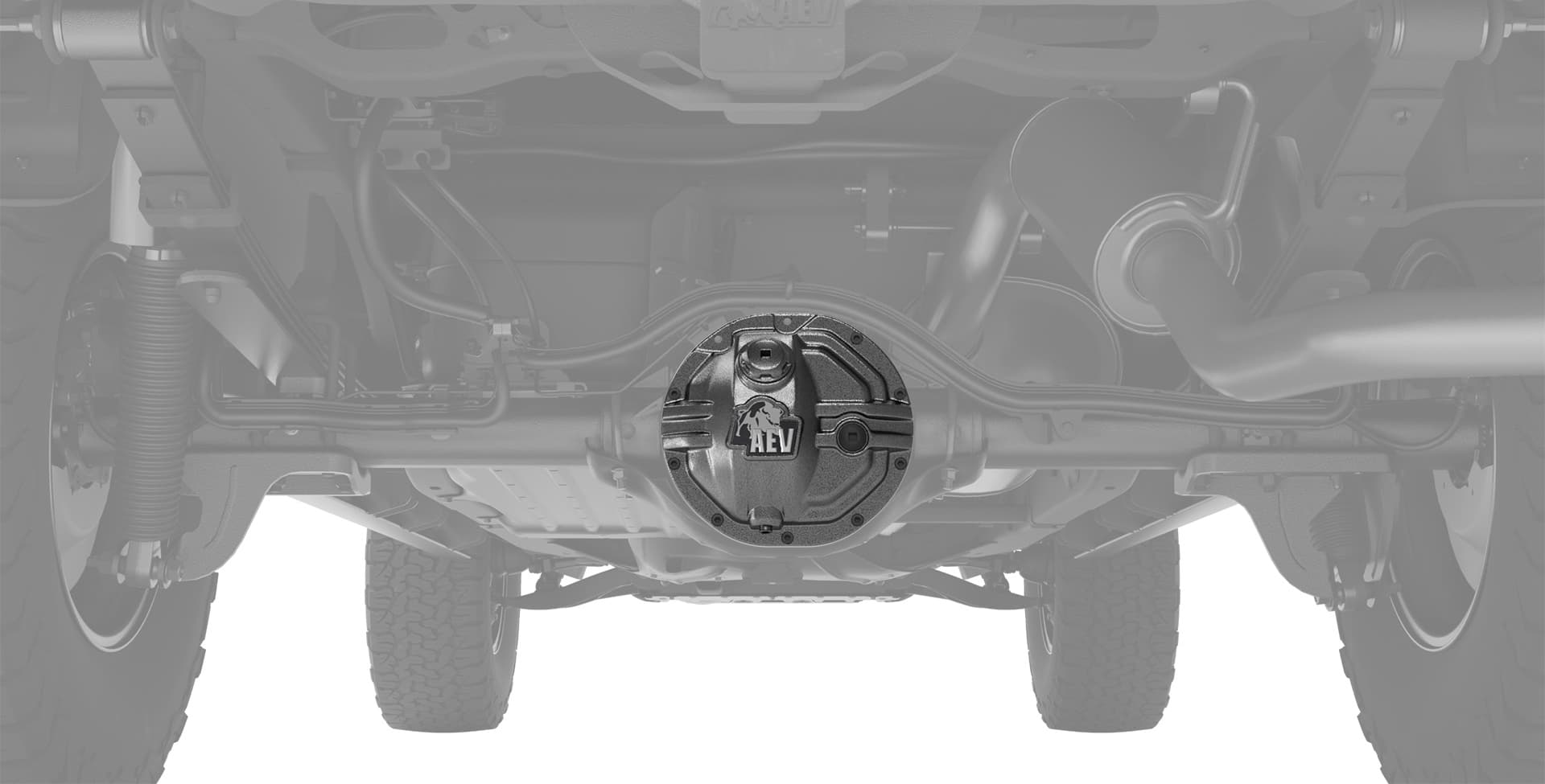 Undercarriage of a vehicle with a rear differential cover labeled 'AEV' on a white background
