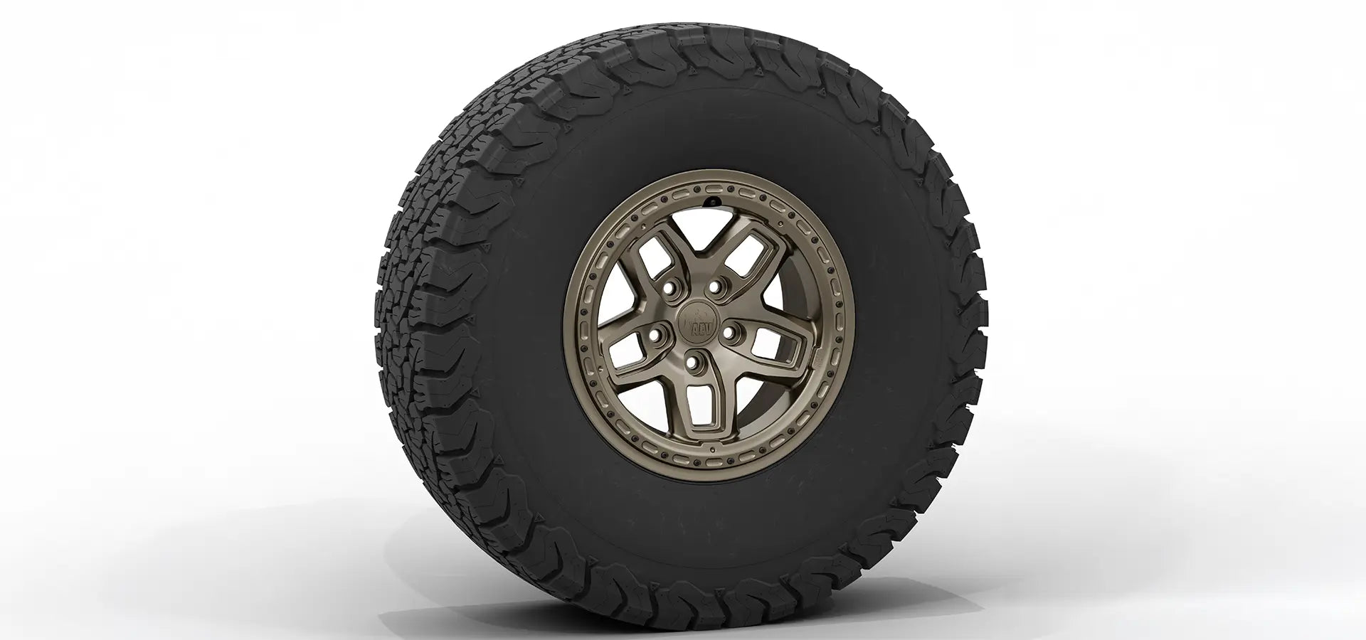 Tire with off-road tread pattern and metallic rim on a white background | Bronze Finish with Hardware Kit