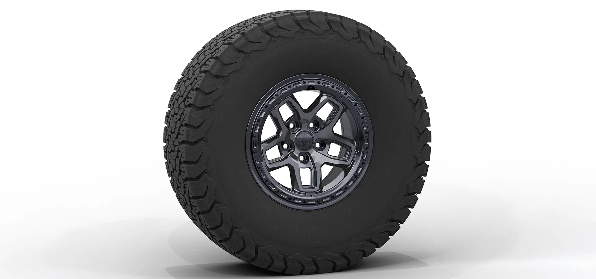 Black off-road tire with a detailed tread pattern on a white background | Onyx Finish with Hardware Kit