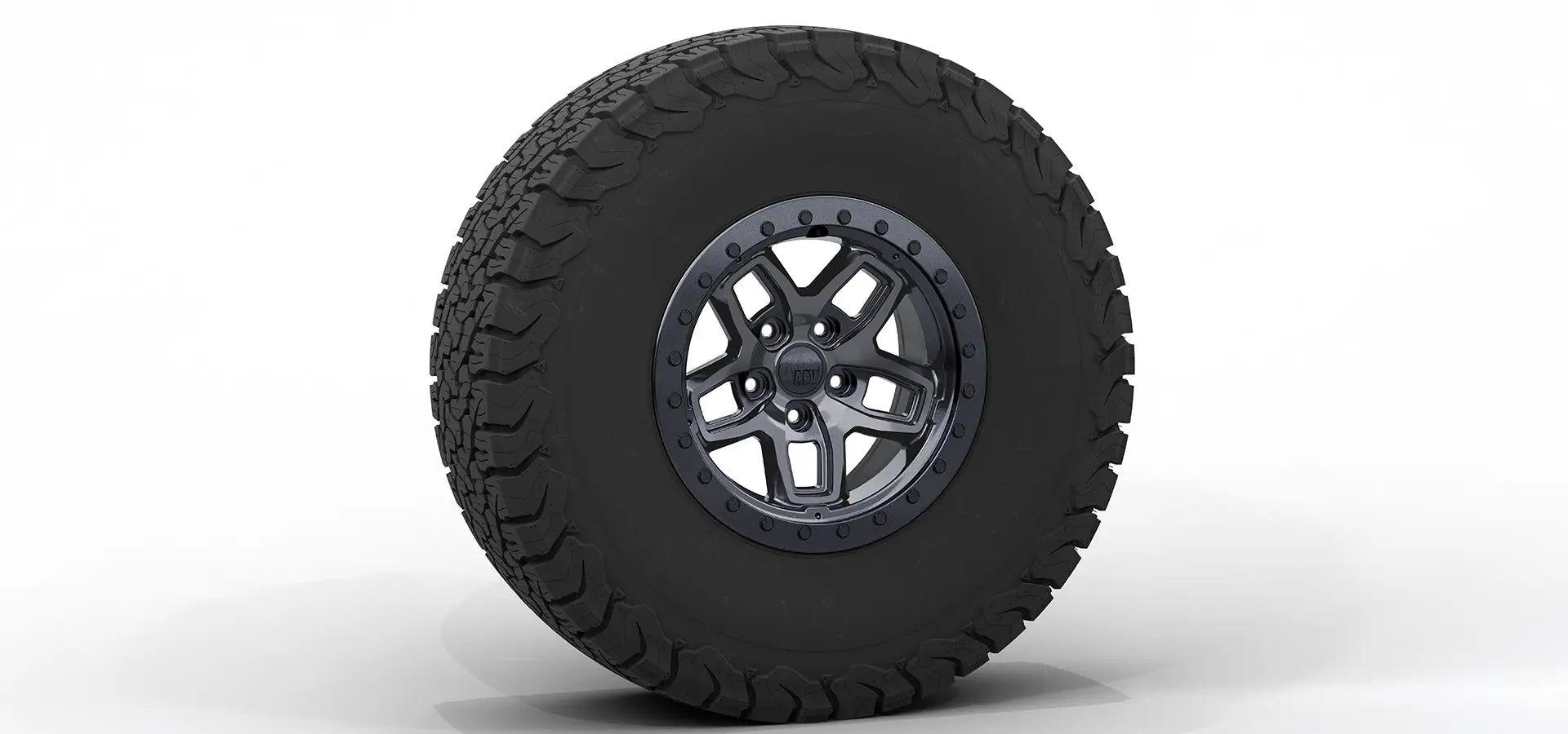Black off-road tire with a detailed tread pattern on a white background | Onyx Finish with Onyx Beadlock Ring