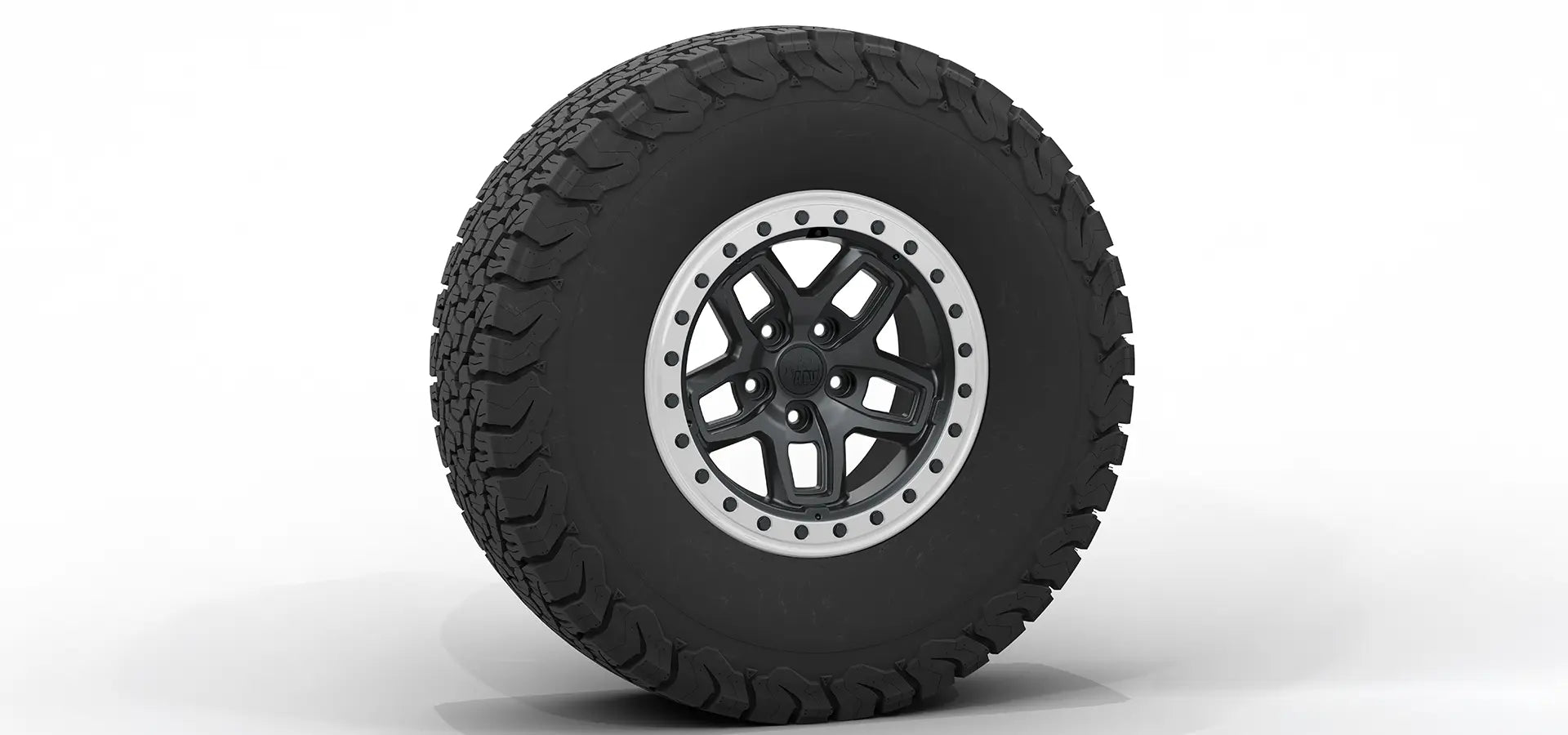 Tire with a black tread pattern and silver rim on a white background | Satin Black Finish with Silver Protection Ring