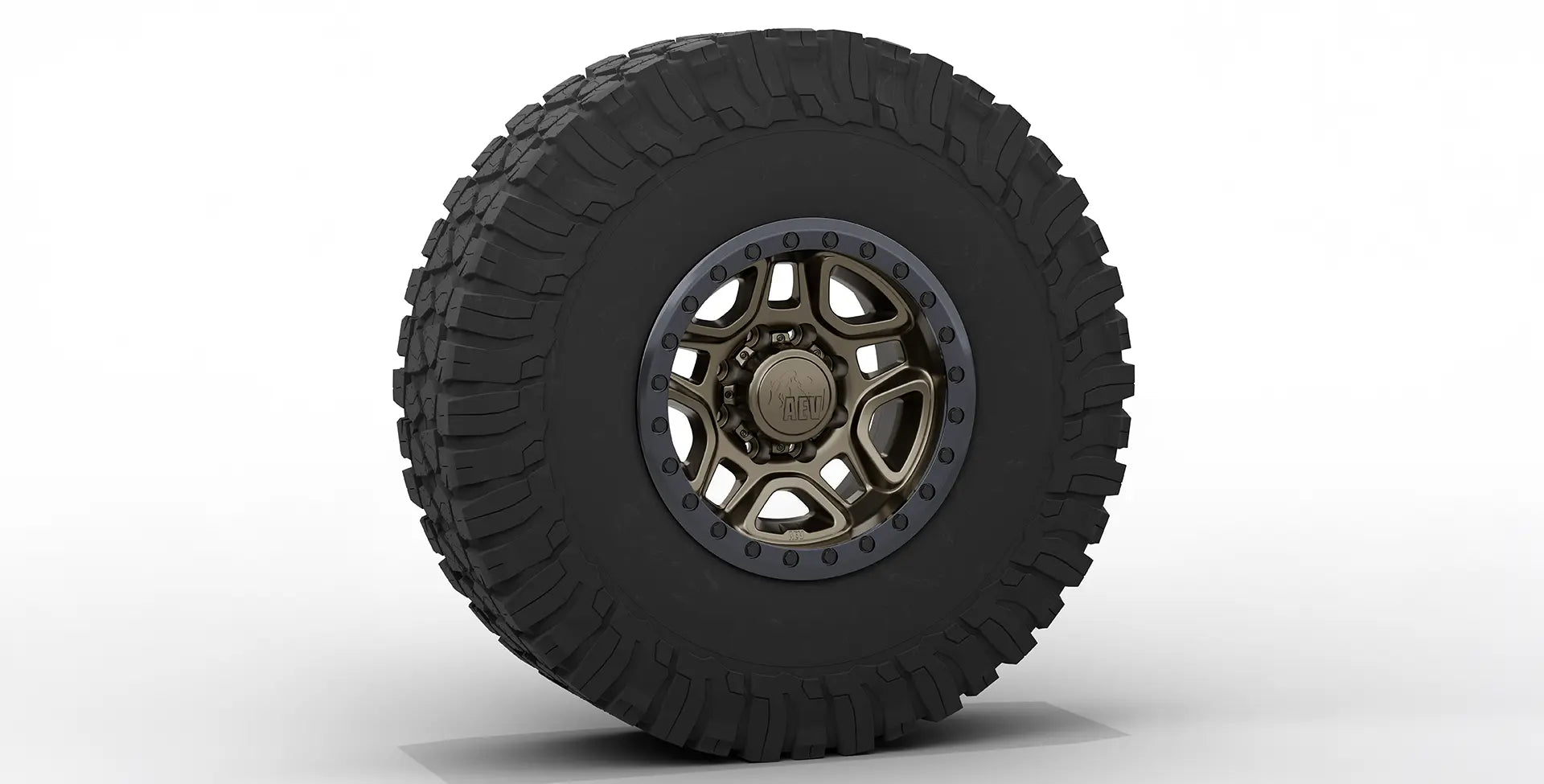 Off-road tire with a metallic rim on a white background | Bronze Finish with Onyx Beadlock Ring