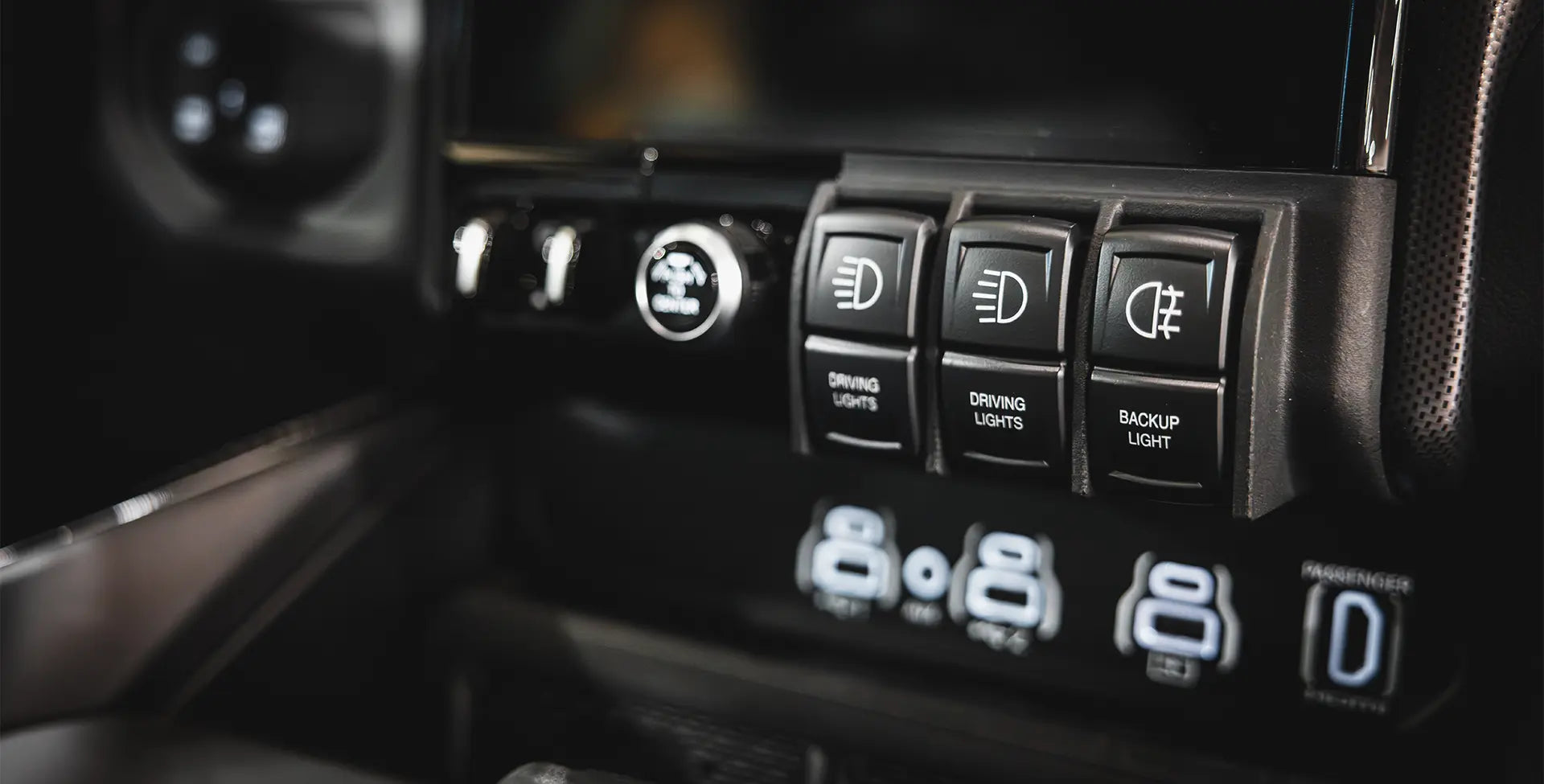 Car dashboard with illuminated control switches for lights and other functions. | Full kit installed in vehicle