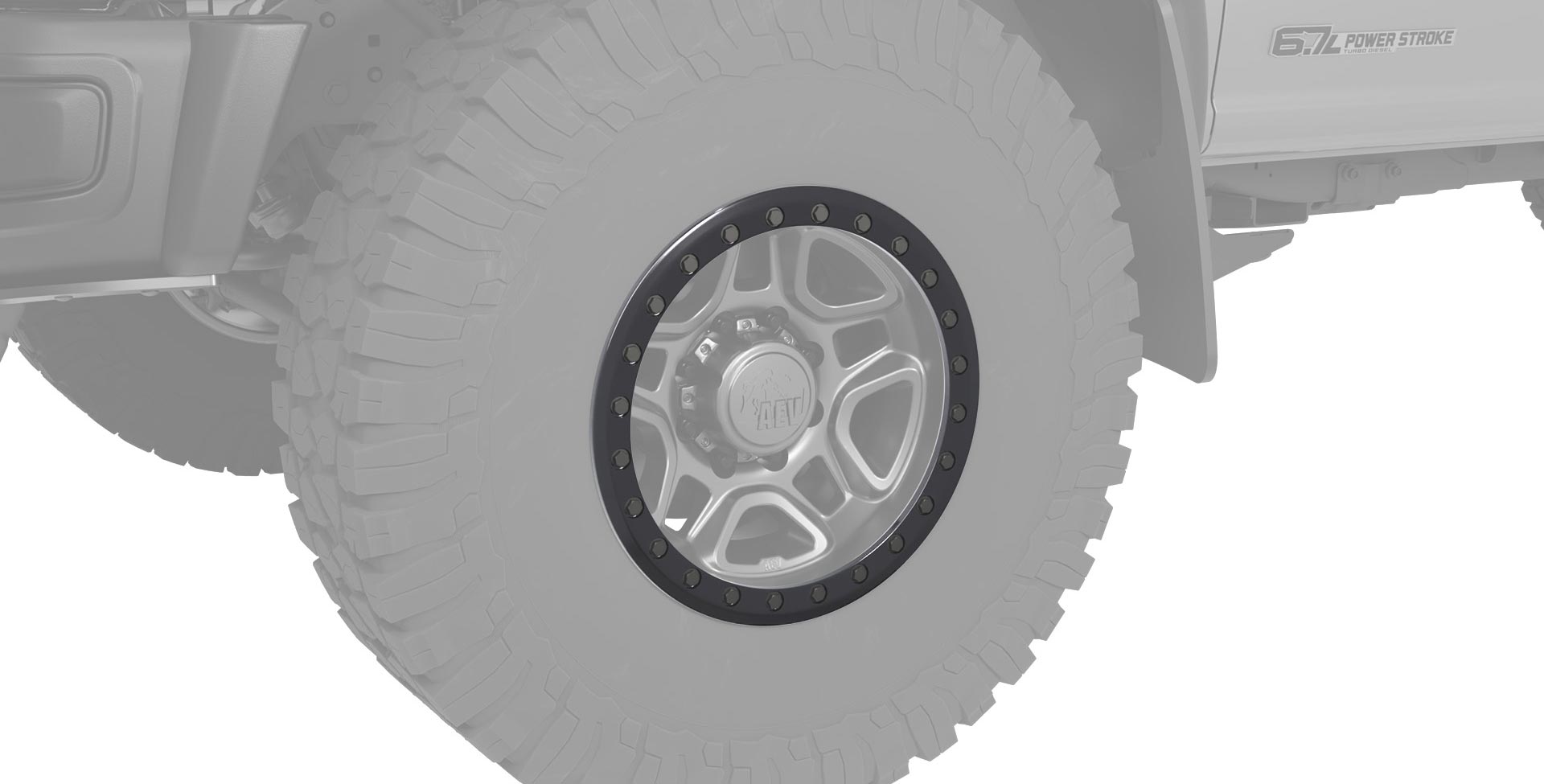 Close-up of a vehicle wheel with a detailed rim design on a white background | Beadlock Ring on Katmai Wheel