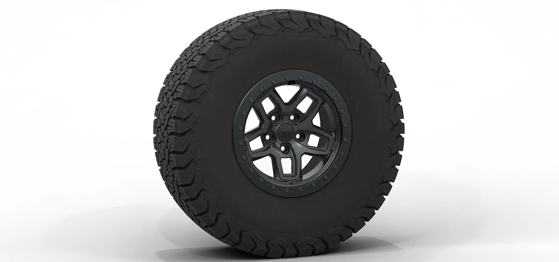 Black tire with a detailed tread pattern on a white background | Satin Black Finish with Satin Black Beadlock Ring