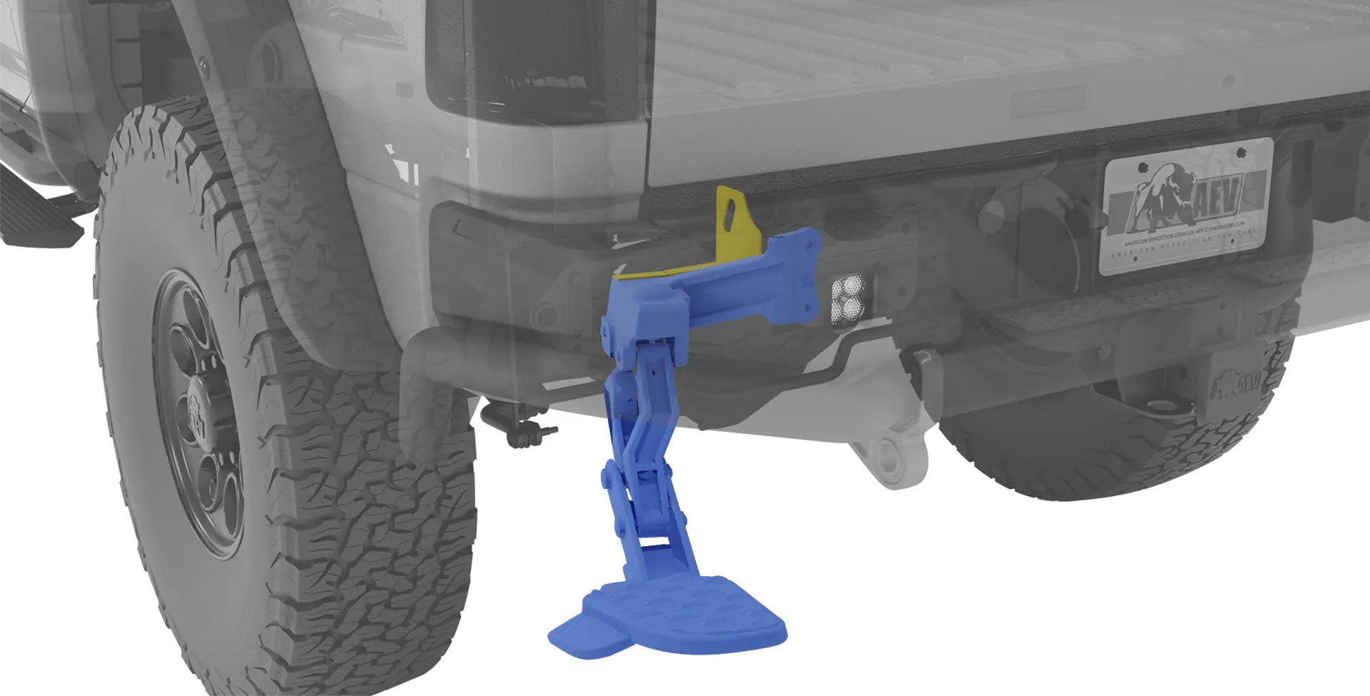 Blue hitch receiver on a truck bumper with a white background | The Mopar® Bed Step (colored blue) shown mounted to the AEV Relocation Bracket (colored yellow)