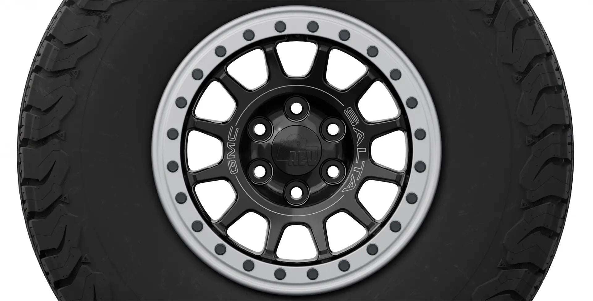 Black off-road tire with a silver rim on a white background | Silver Protection Ring on OE Salta Wheel